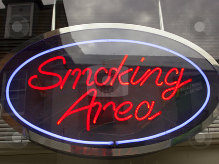 To use this stock image in your creative project, please select the size you need over to the right and click the "Add to Cart" button.
Your downloaded image will come with the Cutcaster watermark removed so don’t worry about the watermark you see on this page. Neon smoking area sign stock photo, Bright neon smoking area sign in city street by Mike Smith