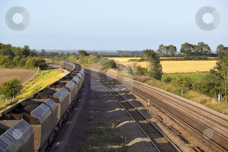 To use this stock image in your creative project, please select the size you need over to the right and click the "Add to Cart" button.
Your downloaded image will come with the Cutcaster watermark removed so don’t worry about the watermark you see on this page. Coal train stock photo, A coal train on railway tracks on a summers day by Mike Smith