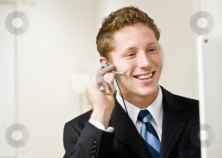 To use this stock image in your creative project, please select the size you need over to the right and click the "Add to Cart" button.
Your downloaded image will come with the Cutcaster watermark removed so don’t worry about the watermark you see on this page. Businessman talking on headset stock photo, Businessman talking on headset by Jonathan Ross