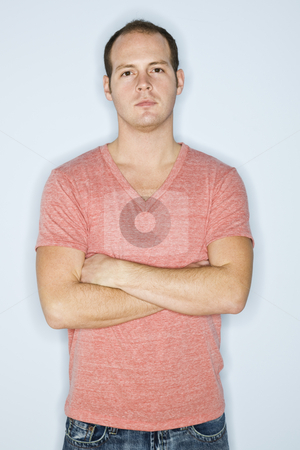 To use this stock image in your creative project, please select the size you need over to the right and click the "Add to Cart" button.
Your downloaded image will come with the Cutcaster watermark removed so don’t worry about the watermark you see on this page. Man Standing with Arms Crossed stock photo, A man is standing against a wall with his arms crossed. He is looking at the camera. Vertically framed shot. by Jonathan Ross