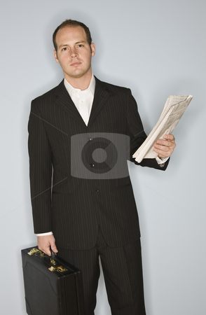 To use this stock image in your creative project, please select the size you need over to the right and click the "Add to Cart" button.
Your downloaded image will come with the Cutcaster watermark removed so don’t worry about the watermark you see on this page. Man with Briefcase stock photo, A young man is holding a briefcase and a newspaper, and is smiling at the camera. Vertically framed shot. by Jonathan Ross
