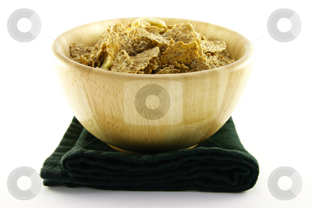 To use this stock image in your creative project, please select the size you need over to the right and click the "Add to Cart" button.
Your downloaded image will come with the Cutcaster watermark removed so don’t worry about the watermark you see on this page. Bran Flakes in a Woodden Bowl stock photo, Crunchy delicious looking bran flakes in a wooden bowl and a black napkin on a white background by Keith Wilson