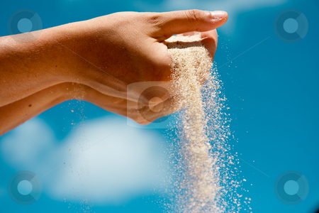 To use this stock image in your creative project, please select the size you need over to the right and click the "Add to Cart" button.
Your downloaded image will come with the Cutcaster watermark removed so don’t worry about the watermark you see on this page. Sand Hand stock photo, Sand flows through a woman's hand on a beach. by Tyson Koska