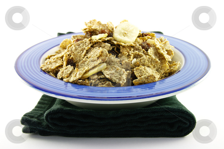 To use this stock image in your creative project, please select the size you need over to the right and click the "Add to Cart" button.
Your downloaded image will come with the Cutcaster watermark removed so don’t worry about the watermark you see on this page. Bran Flakes in a Blue Bowl stock photo, Crunchy delicious looking bran flakes in a blue bowl and a black napkin on a white background by Keith Wilson