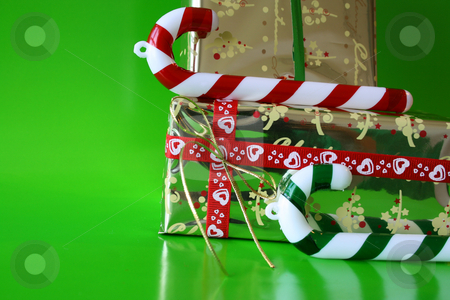 To use this stock image in your creative project, please select the size you need over to the right and click the "Add to Cart" button.
Your downloaded image will come with the Cutcaster watermark removed so don’t worry about the watermark you see on this page. Candy and Gifts stock photo, Christmas decorations as candy canes and wrapped gifts by Vanessa Van Rensburg