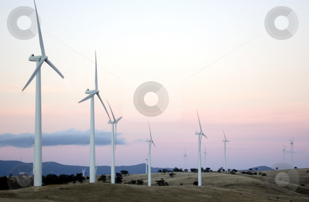 To use this stock image in your creative project, please select the size you need over to the right and click the "Add to Cart" button.
Your downloaded image will come with the Cutcaster watermark removed so don’t worry about the watermark you see on this page. Wind Farm at Sunset stock photo, Wind generators sit separated along the hilltops of a modern wind farm by Lee Torrens