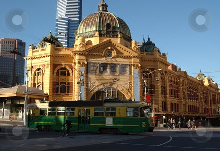 To use this stock image in your creative project, please select the size you need over to the right and click the "Add to Cart" button.
Your downloaded image will come with the Cutcaster watermark removed so don’t worry about the watermark you see on this page. Flinders Street Station stock photo, The entrance to Melbourne's Flinders Street Station with a classic tram passing in front by Lee Torrens