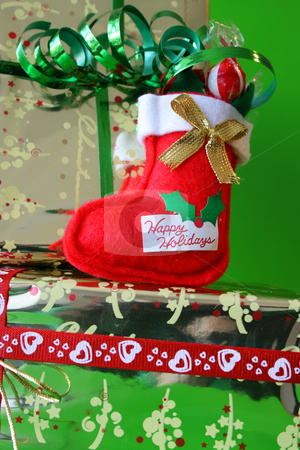 To use this stock image in your creative project, please select the size you need over to the right and click the "Add to Cart" button.
Your downloaded image will come with the Cutcaster watermark removed so don’t worry about the watermark you see on this page. Stockings stock photo, Miniature Christmas Stocking on a gold wrapped gift by Vanessa Van Rensburg