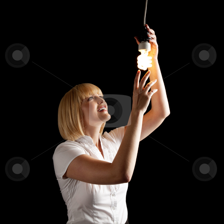 To use this stock image in your creative project, please select the size you need over to the right and click the "Add to Cart" button.
Your downloaded image will come with the Cutcaster watermark removed so don’t worry about the watermark you see on this page. Attractive Blonde Turning on Lightbulb stock photo, An attractive blonde touching a lightbulb. Square framed shot. by Media Deva