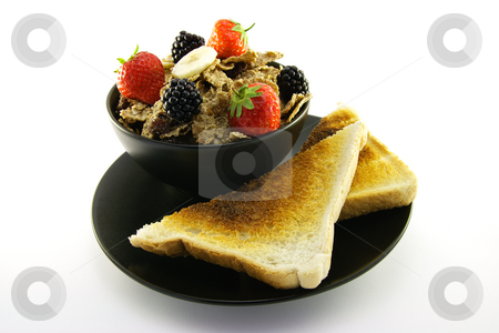 To use this stock image in your creative project, please select the size you need over to the right and click the "Add to Cart" button.
Your downloaded image will come with the Cutcaster watermark removed so don’t worry about the watermark you see on this page. Bran Flakes in a Black Bowl stock photo, Crunchy looking delicious bran flakes and juicy fruit in a black bowl with toast on a white background by Keith Wilson