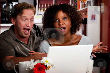 To use this stock image in your creative project, please select the size you need over to the right and click the "Add to Cart" button.
Your downloaded image will come with the Cutcaster watermark removed so don’t worry about the watermark you see on this page. Mixed race couple in coffee house with laptop computer stock photo, Caucasian man and African American woman in coffee house with laptop computer by Scott Griessel