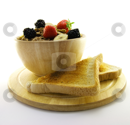To use this stock image in your creative project, please select the size you need over to the right and click the "Add to Cart" button.
Your downloaded image will come with the Cutcaster watermark removed so don’t worry about the watermark you see on this page. Bran Flakes in a Wooden Bowl stock photo, Crunchy looking delicious bran flakes and juicy fruit in a wooden bowl with toast on a white background by Keith Wilson