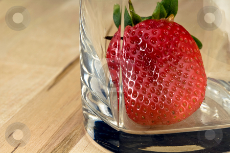 To use this stock image in your creative project, please select the size you need over to the right and click the "Add to Cart" button.
Your downloaded image will come with the Cutcaster watermark removed so don’t worry about the watermark you see on this page. Strawberry in the glass stock photo, Big fresh strawberry in the whiskey glass on wood table by Oleg Karpenko