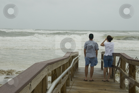 To use this stock image in your creative project, please select the size you need over to the right and click the "Add to Cart" button.
Your downloaded image will come with the Cutcaster watermark removed so don’t worry about the watermark you see on this page. Gustav Walkway Spectators stock photo, PENSACOLA - SEP 1: A couple watches the raging surf from an elevated walkway during Hurricane Gustav on September 1, 2008. Gustav made landfall in Lousiana only 1 mph below a Cat 3. by A Cotton Photo