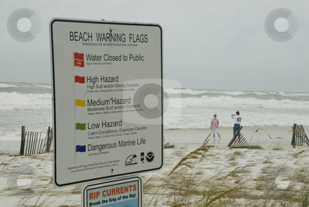 To use this stock image in your creative project, please select the size you need over to the right and click the "Add to Cart" button.
Your downloaded image will come with the Cutcaster watermark removed so don’t worry about the watermark you see on this page. Quaking Sign stock photo, PENSACOLA - SEP 1: A couple takes photos of the incoming surf while a warning sign quakes in the wind during Hurricane Gustav on September 1, 2008. Gustav reached winds of 150 mph. by A Cotton Photo