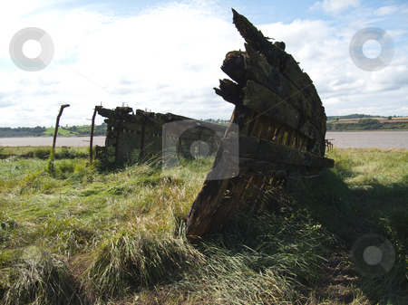 To use this stock image in your creative project, please select the size you need over to the right and click the "Add to Cart" button.
Your downloaded image will come with the Cutcaster watermark removed so don’t worry about the watermark you see on this page. Boat - Shipwrecked stock photo, A shipwrecked boat in the Purton Hulks Graveyard, Gloucestershire by Stephen Clarke
