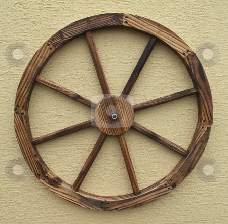 To use this stock image in your creative project, please select the size you need over to the right and click the "Add to Cart" button.
Your downloaded image will come with the Cutcaster watermark removed so don’t worry about the watermark you see on this page. Wagon Wheel stock photo, A decorative wagon wheel isolated on a wall by Stephen Clarke
