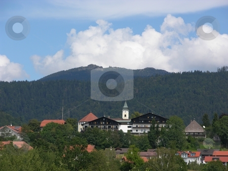 To use this stock image in your creative project, please select the size you need over to the right and click the "Add to Cart" button.
Your downloaded image will come with the Cutcaster watermark removed so don’t worry about the watermark you see on this page. Village in Bavaria stock photo, Village Bodenmais in Bavaria in front of the mountain Arber, highest mountain of the Bavarian forest by Robert Biedermann