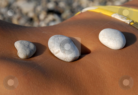 To use this stock image in your creative project, please select the size you need over to the right and click the "Add to Cart" button.
Your downloaded image will come with the Cutcaster watermark removed so don’t worry about the watermark you see on this page. Rocks on stomach stock photo, Three rocks on woman sunburned stomach closeup by Julija Sapic