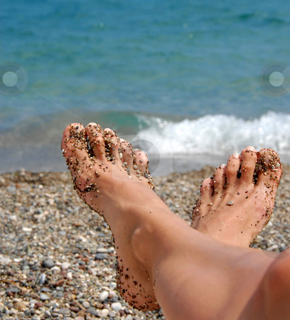 To use this stock image in your creative project, please select the size you need over to the right and click the "Add to Cart" button.
Your downloaded image will come with the Cutcaster watermark removed so don’t worry about the watermark you see on this page. Feet in rocks stock photo, Lying woman feet in tiny rocks on pebble beach by Julija Sapic