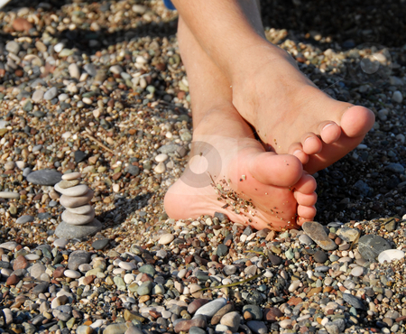 To use this stock image in your creative project, please select the size you need over to the right and click the "Add to Cart" button.
Your downloaded image will come with the Cutcaster watermark removed so don’t worry about the watermark you see on this page. Rocks stack and boy feet stock photo, Child feet next to rocks stack on beach by Julija Sapic
