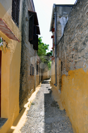 To use this stock image in your creative project, please select the size you need over to the right and click the "Add to Cart" button.
Your downloaded image will come with the Cutcaster watermark removed so don’t worry about the watermark you see on this page. Narrow street in the medieval town of Rhodes. stock photo, Travel Europe: Narrow street in the mediaval town of Rhodes. Greece. by Fernando Barozza