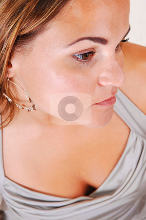 To use this stock image in your creative project, please select the size you need over to the right and click the "Add to Cart" button.
Your downloaded image will come with the Cutcaster watermark removed so don’t worry about the watermark you see on this page. Pretty girl in silver dress. stock photo, Young, lovely girl in a silver dress with nice earrings in an close-up shoot
of her face and chest, in the studio for white background. by Horst Petzold