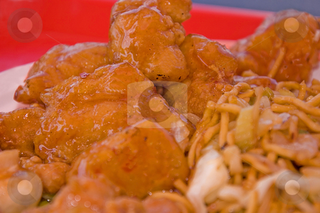 To use this stock image in your creative project, please select the size you need over to the right and click the "Add to Cart" button.
Your downloaded image will come with the Cutcaster watermark removed so don’t worry about the watermark you see on this page. Sweet & Sour Chicken stock photo, This dish is the Chinese food sweet and sour deep fried chicken with some chow mein to the side. by Valerie Garner