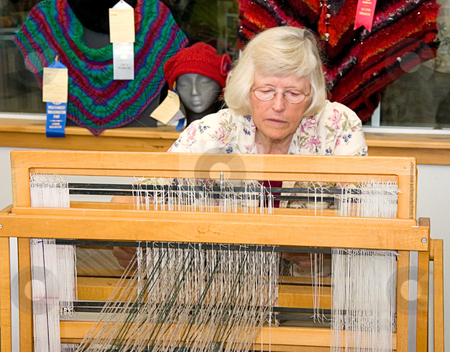 To use this stock image in your creative project, please select the size you need over to the right and click the "Add to Cart" button.
Your downloaded image will come with the Cutcaster watermark removed so don’t worry about the watermark you see on this page. LYNDEN, WA - August 19, 2009 - Jane Doe Weaving At Fair stock photo, LYNDEN, WA - August 19, 2009 - Jane Doe is demonstrating at a live event at Lynden Fair recently the use of a textile loom by this senior aged woman. Temps recently hit in the triple digits. by Valerie Garner