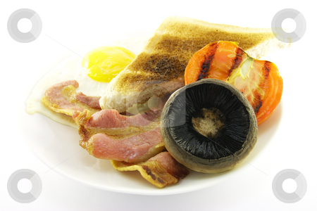 To use this stock image in your creative project, please select the size you need over to the right and click the "Add to Cart" button.
Your downloaded image will come with the Cutcaster watermark removed so don’t worry about the watermark you see on this page. Breakfast and Toast on a White Plate stock photo, Slices of crispy pork bacon with half a grilled tomato a fried egg, mushroom and a slice of lightly toasted bread on a black round plate with a white background by Keith Wilson