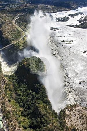 To use this stock image in your creative project, please select the size you need over to the right and click the "Add to Cart" button.
Your downloaded image will come with the Cutcaster watermark removed so don’t worry about the watermark you see on this page. Victoria falls By Air stock photo, Aerial view of Victoria Falls taken from over Zambia looking towards Zimbabwe by Darren Pattterson