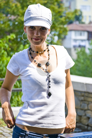 To use this stock image in your creative project, please select the size you need over to the right and click the "Add to Cart" button.
Your downloaded image will come with the Cutcaster watermark removed so don’t worry about the watermark you see on this page. Beautiful young woman with hat stock photo, Beautiful young smiling woman with hat by Desislava Dimitrova