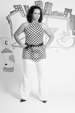 To use this stock image in your creative project, please select the size you need over to the right and click the "Add to Cart" button.
Your downloaded image will come with the Cutcaster watermark removed so don’t worry about the watermark you see on this page. Mad Women stock photo, Twenty something latino women with mad expression standing in front of a graffitied wall by Yann Poirier
