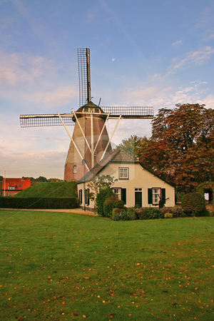 To use this stock image in your creative project, please select the size you need over to the right and click the "Add to Cart" button.
Your downloaded image will come with the Cutcaster watermark removed so don’t worry about the watermark you see on this page. House and windmill in the Netherlands vertical stock photo, House and windmill in the Netherlands with green grass and blue sky vertical by Stephen Goodwin