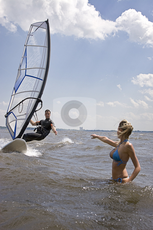 To use this stock image in your creative project, please select the size you need over to the right and click the "Add to Cart" button.
Your downloaded image will come with the Cutcaster watermark removed so don’t worry about the watermark you see on this page. Windsurfer reaching for girlfriend stock photo, Windsurfer coming in at full speed with hand reaching for girlfriend by Yann Poirier