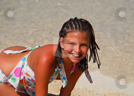 To use this stock image in your creative project, please select the size you need over to the right and click the "Add to Cart" button.
Your downloaded image will come with the Cutcaster watermark removed so don’t worry about the watermark you see on this page. Beach fun stock photo, Pretty girl with big smile playing on the beach by Monica Boorboor