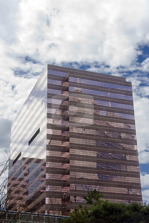 To use this stock image in your creative project, please select the size you need over to the right and click the "Add to Cart" button.
Your downloaded image will come with the Cutcaster watermark removed so don’t worry about the watermark you see on this page. Pink Office Building stock photo, A pink office building with mirrored glass by Kevin Tietz