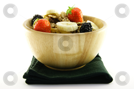 To use this stock image in your creative project, please select the size you need over to the right and click the "Add to Cart" button.
Your downloaded image will come with the Cutcaster watermark removed so don’t worry about the watermark you see on this page. Bran Flakes in a Woodden Bowl stock photo, Crunchy delicious looking bran flakes and juicy fruit in a wooden bowl and a black napkin on a white background by Keith Wilson