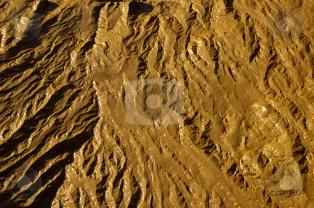 To use this stock image in your creative project, please select the size you need over to the right and click the "Add to Cart" button.
Your downloaded image will come with the Cutcaster watermark removed so don’t worry about the watermark you see on this page. Mudflats stock photo, Close-up abstract of wet mud on a tidal river shore. Suitable as an abstract, patterned background. by Alistair Scott