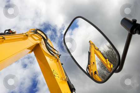 To use this stock image in your creative project, please select the size you need over to the right and click the "Add to Cart" button.
Your downloaded image will come with the Cutcaster watermark removed so don’t worry about the watermark you see on this page. Mechanical arms stock photo, Earth moving machines and forklift arms, one reflected in a side mirror, against a moody sky by Corepics VOF