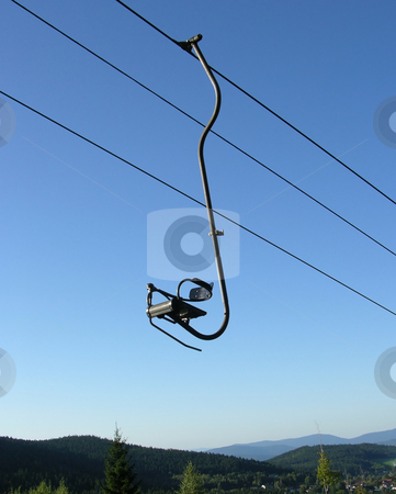 To use this stock image in your creative project, please select the size you need over to the right and click the "Add to Cart" button.
Your downloaded image will come with the Cutcaster watermark removed so don’t worry about the watermark you see on this page. Chair-lift and the blue sky stock photo, Chair-lift and the blue sky by Robert Biedermann