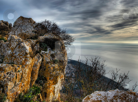 To use this stock image in your creative project, please select the size you need over to the right and click the "Add to Cart" button.
Your downloaded image will come with the Cutcaster watermark removed so don’t worry about the watermark you see on this page. Rocks and sea stock photo, Looking towards the Adriatic sea from a high hiill somewhere on the island of Cres, Croatia. by Sinisa Botas