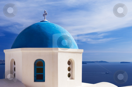 To use this stock image in your creative project, please select the size you need over to the right and click the "Add to Cart" button.
Your downloaded image will come with the Cutcaster watermark removed so don’t worry about the watermark you see on this page. Blue church dome in Santorini, Greece stock photo, A church with a blue dome overlooks the spectacular caldera surrounding the beautiful island of Santorini, Greece by Andreas Karelias