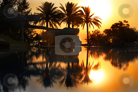 To use this stock image in your creative project, please select the size you need over to the right and click the "Add to Cart" button.
Your downloaded image will come with the Cutcaster watermark removed so don’t worry about the watermark you see on this page. Sunrise over swimming pool stock photo, Sunrise above swimming pool on Mediterranean seaside in summer resort in Turkey by Julija Sapic