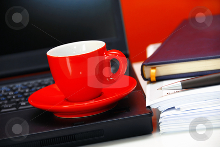 To use this stock image in your creative project, please select the size you need over to the right and click the "Add to Cart" button.
Your downloaded image will come with the Cutcaster watermark removed so don’t worry about the watermark you see on this page. Business still life stock photo, Red cup over black notebook on office desk still life by Julija Sapic