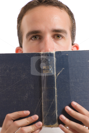 To use this stock image in your creative project, please select the size you need over to the right and click the "Add to Cart" button.
Your downloaded image will come with the Cutcaster watermark removed so don’t worry about the watermark you see on this page. Holy Bible stock photo, A young man reading the Holy Bible, isolated against a white background by Richard Nelson