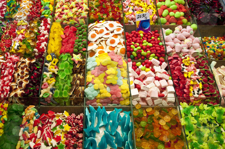 To use this stock image in your creative project, please select the size you need over to the right and click the "Add to Cart" button.
Your downloaded image will come with the Cutcaster watermark removed so don’t worry about the watermark you see on this page. Candy stand stock photo, Candy stand at Boqueria Market in Barcelona, Spain. by Anibal Trejo