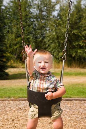 To use this stock image in your creative project, please select the size you need over to the right and click the "Add to Cart" button.
Your downloaded image will come with the Cutcaster watermark removed so don’t worry about the watermark you see on this page. Cute Baby Boy stock photo, A portrait of a cute one year old baby boy on a swing. by Travis Manley