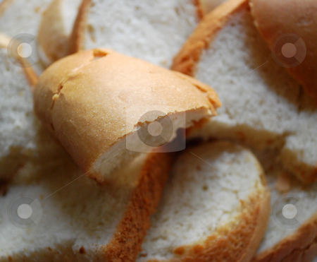 To use this stock image in your creative project, please select the size you need over to the right and click the "Add to Cart" button.
Your downloaded image will come with the Cutcaster watermark removed so don’t worry about the watermark you see on this page. Fresh Slices Of Loaf stock photo, Some fresh slices of loaf with a crisp by Skovoroda