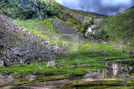 To use this stock image in your creative project, please select the size you need over to the right and click the "Add to Cart" button.
Your downloaded image will come with the Cutcaster watermark removed so don’t worry about the watermark you see on this page. Stone Ruins in Glendalough stock photo, A scence of stone ruins in Glendalough with a waterfall and stream. by Stephen Kiernan